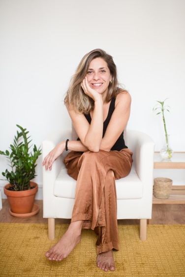 Young professional consultant smiling siiting in a comfy chair